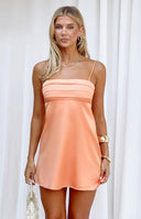 Beginning Boutique Chantell Orange Mini Dress soft orange satin mini dress with a straight neckline, thin spaghetti straps, a