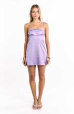 Square neckline of a lilac mini dress with thin spaghetti straps and horizontal pleats across the bust