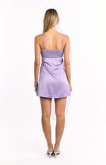 Rear view of a lilac mini dress with a shirred back bodice and thin spaghetti straps