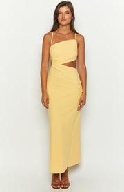 Yellow maxi dress featuring an asymmetrical strap neckline, side cutouts, and ruched waist detail