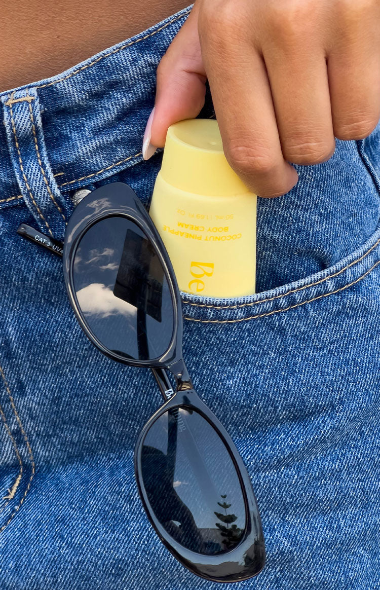 Yellow tube of body cream, pocket