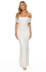 Front view of a white polka dot mesh maxi dress with a ruched off-shoulder neckline and fitted silhouette