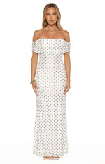 White polka dot mesh maxi dress with an off-shoulder ruffled neckline and a fitted bodice