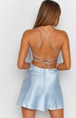 Light blue satin mini dress with a low open back and criss-cross tie-up straps