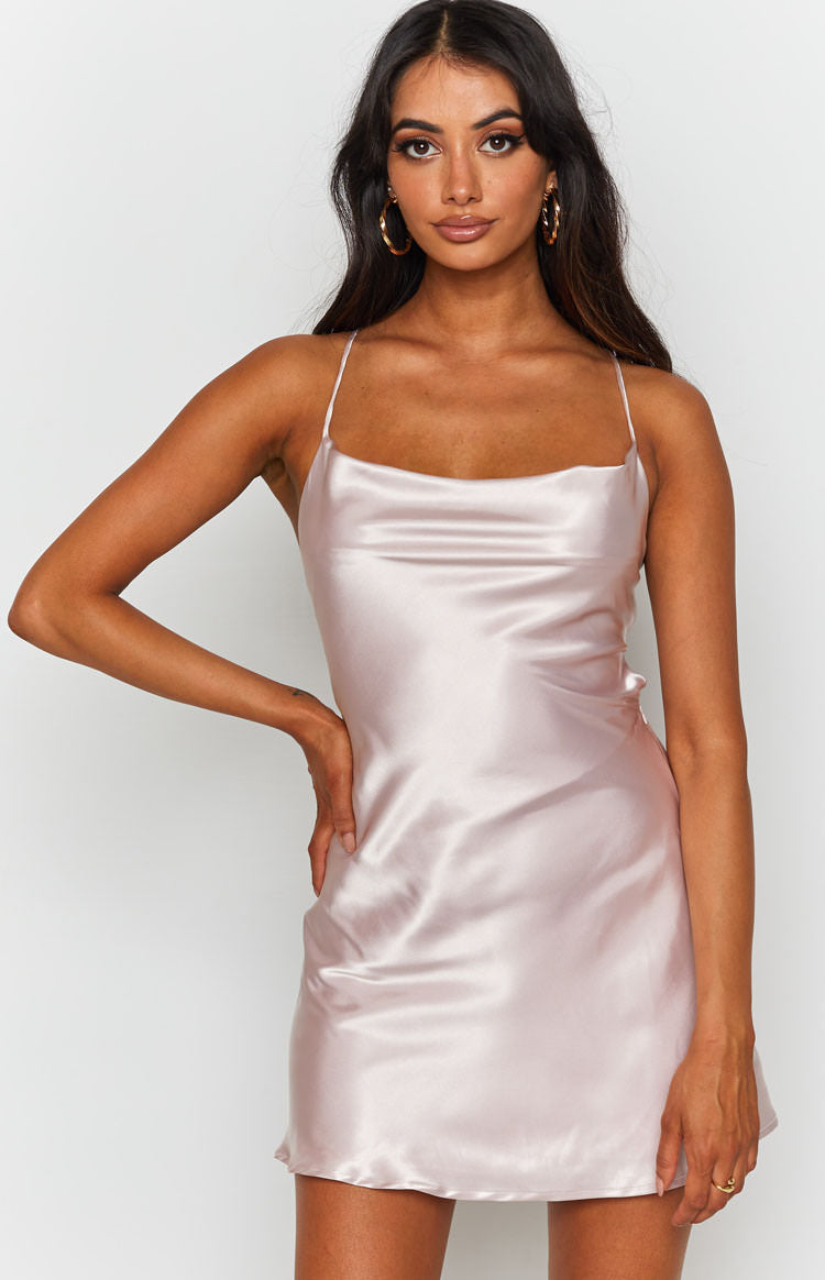Blush pink silky satin mini dress with a draped cowl neckline and thin spaghetti straps