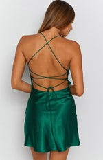 Emerald satin mini dress with a low draped cowl back, criss-cross spaghetti straps, and tie closure