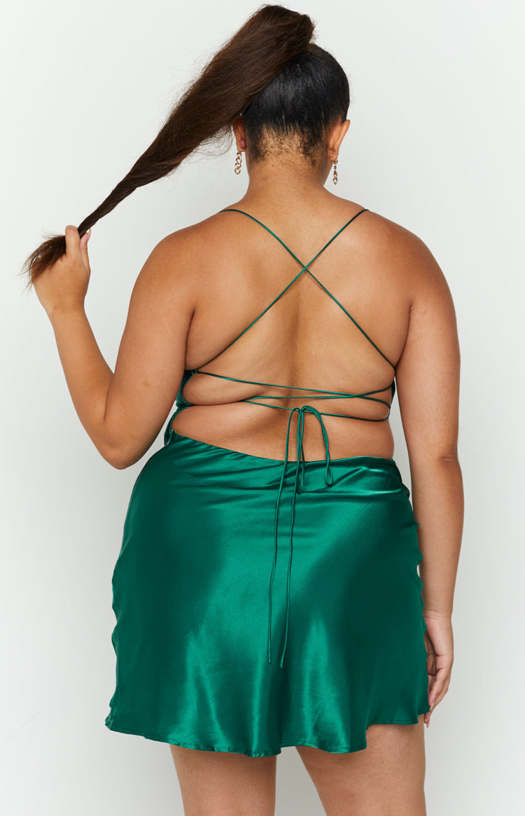 Emerald green satin mini dress with a low open back and criss-cross tie straps