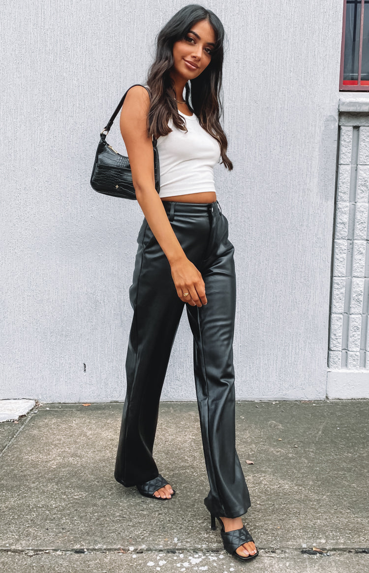 Black PU pants featuring a silver button closure and visible fly stitching