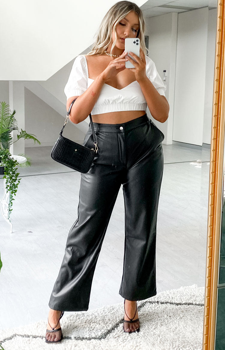 Black PU high-waisted straight leg pants with a single button closure