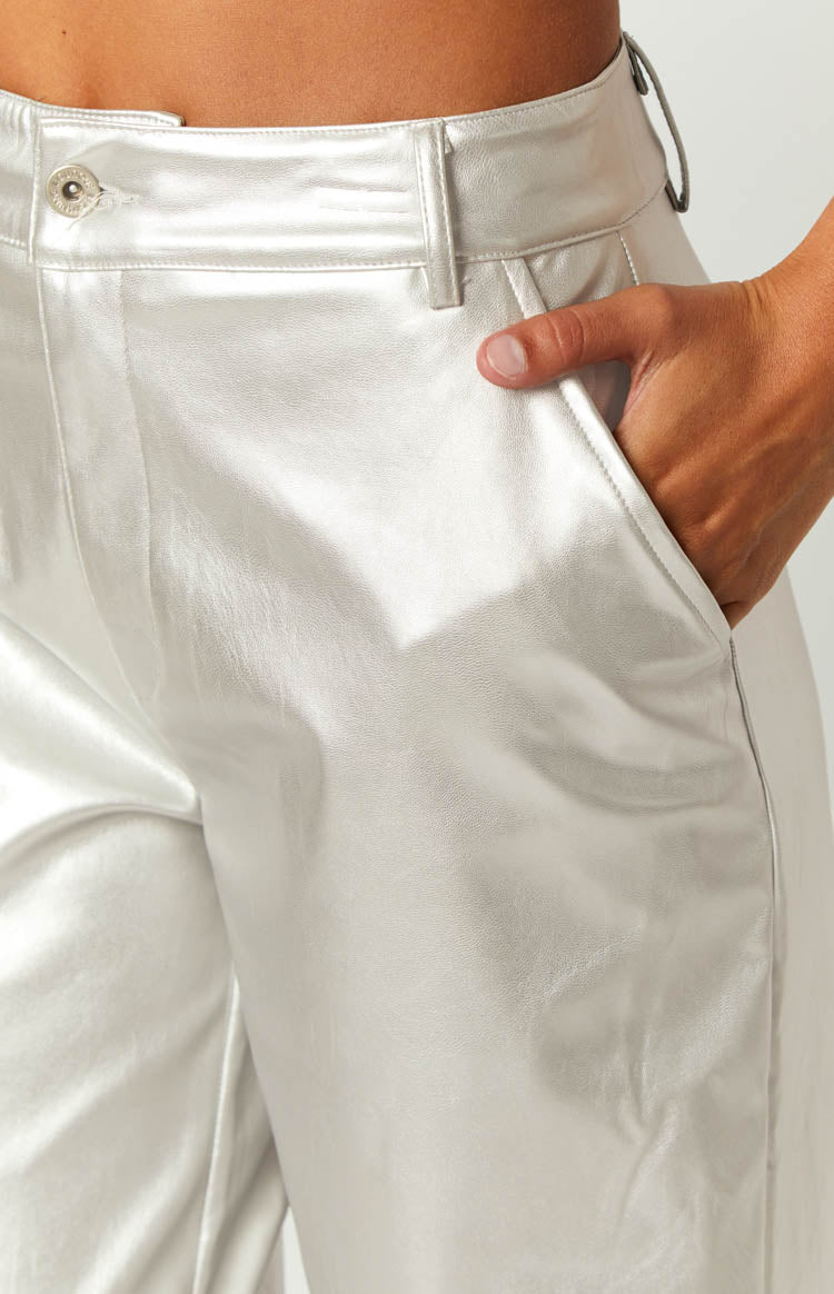 Silver metallic high-waisted wide-leg pants with a smooth, reflective finish