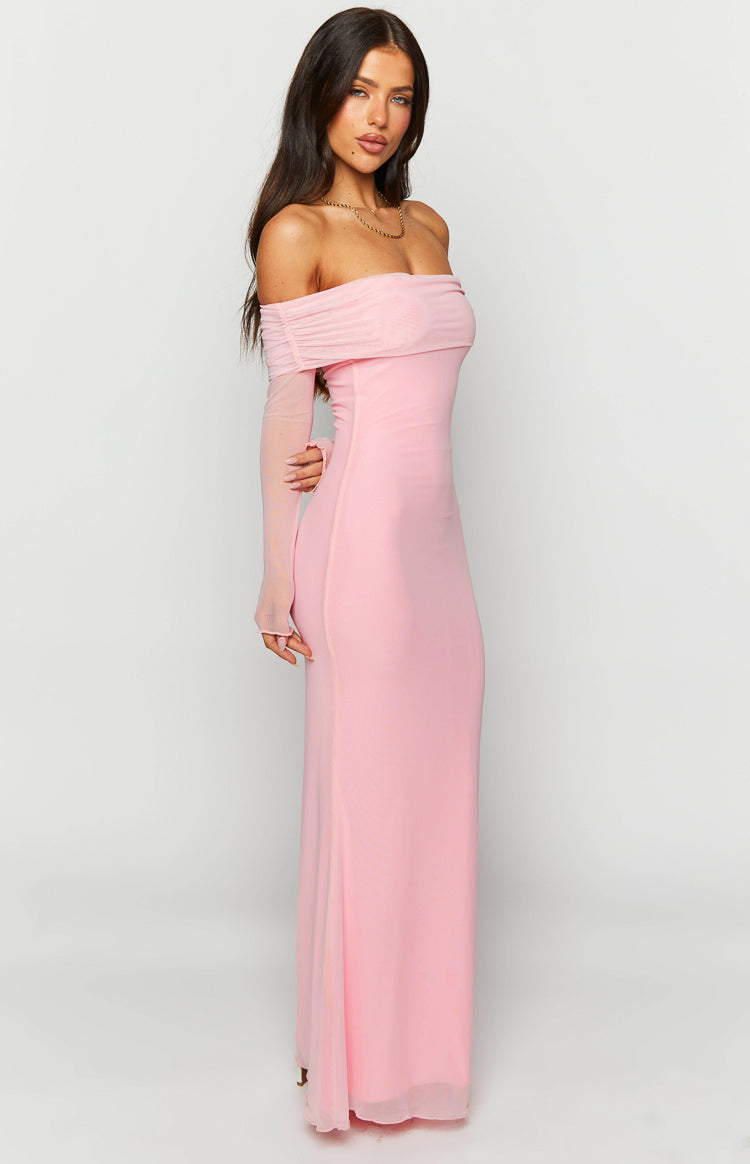 Side view of a pink off-shoulder maxi dress with a ruched neckline, sheer long sleeves, and a subtle side slit