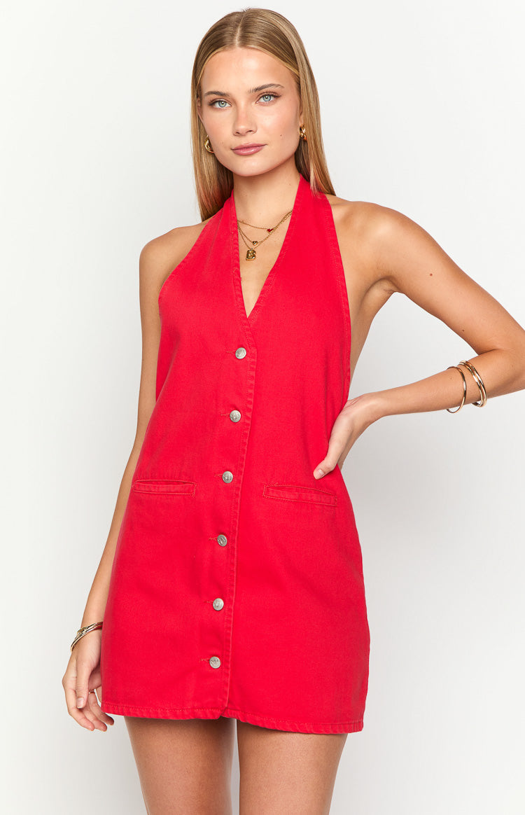 Front view of the red denim mini dress showing the halter neckline, button-front closure, and small front pockets