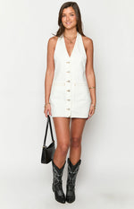 White denim halter neck mini dress with a full button-front closure and contrast stitching details
