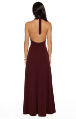 Rear view of the burgundy maxi dress with a halter neck tie, low open back, and center back zip