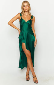 Asymmetrical green satin maxi dress with a high leg slit, V-neck, and ruffled straps