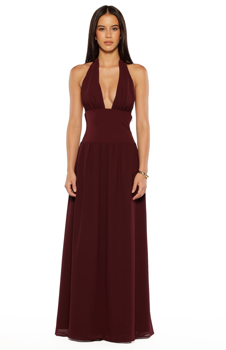 Front view of a burgundy maxi dress with a deep V-neck halter and a flowy pleated skirt