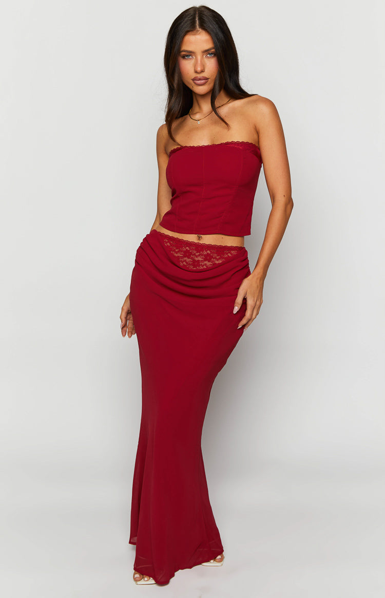Crimson rose red maxi skirt with a draped front waist and visible lace trim detail