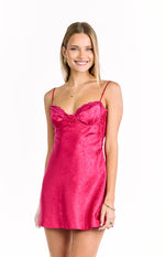 Hot pink satin mini dress with a subtle floral jacquard pattern and lace-trimmed sweetheart neckline