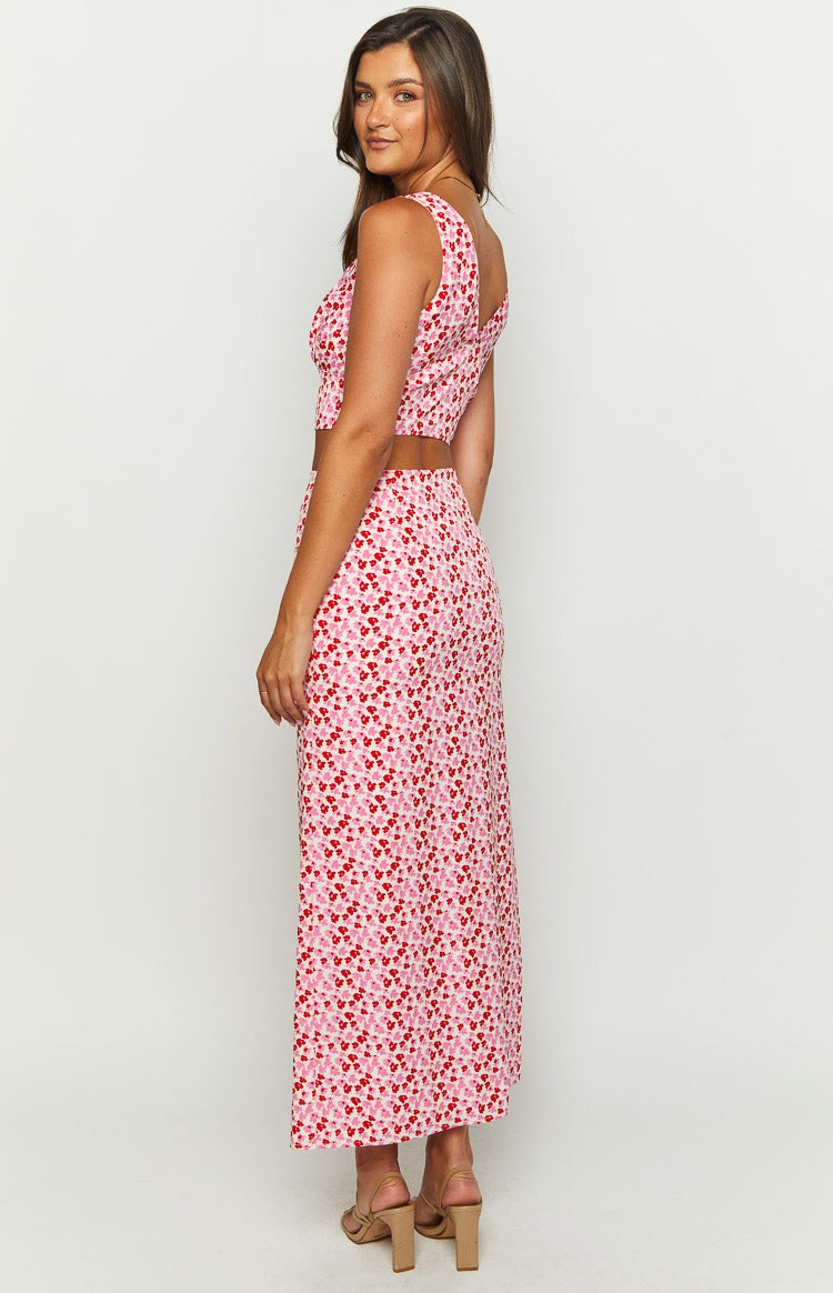 Side view of the pink and red speckled maxi skirt, showing its straight silhouette and flowy drape