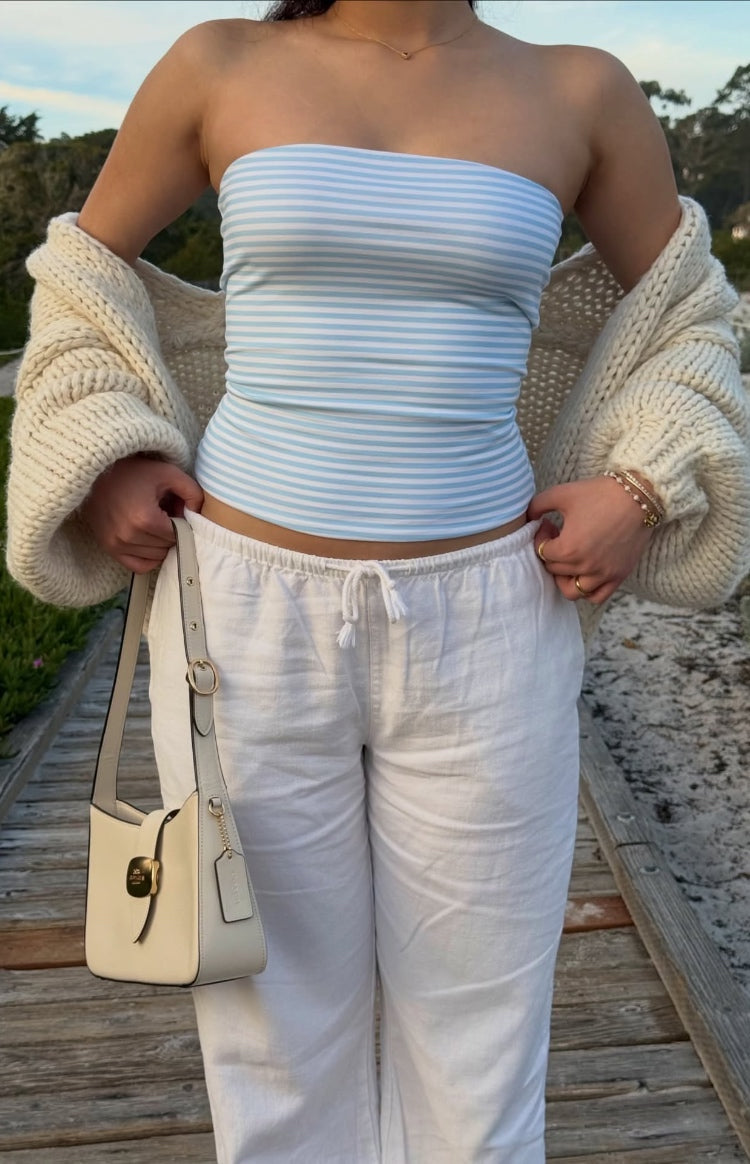 Front view of a fitted blue and white horizontal striped knit tube top