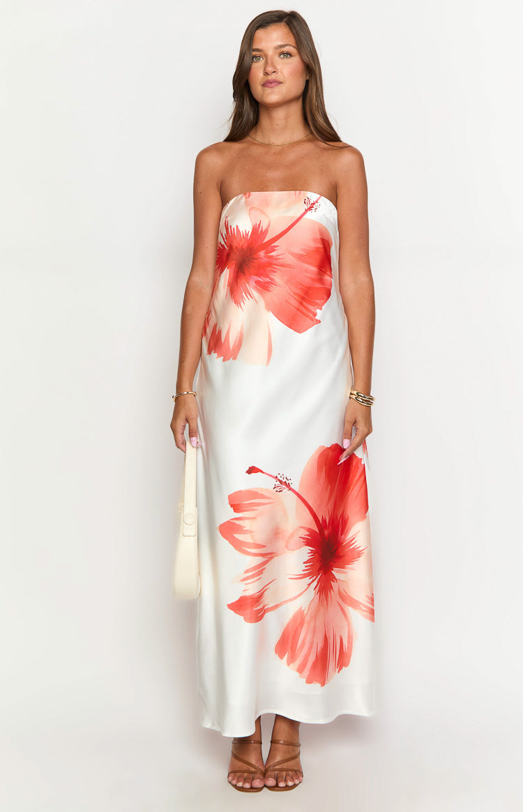 Front view of a white strapless maxi dress featuring a vibrant red and peach hibiscus floral print