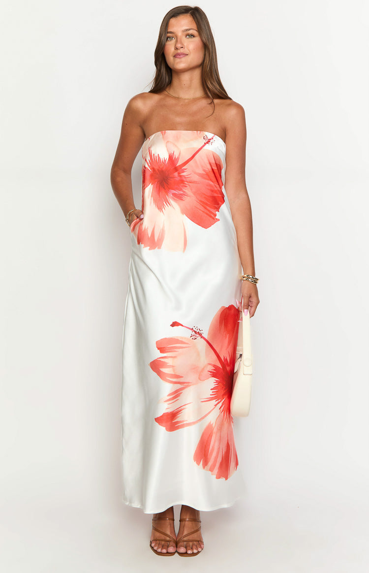 Full length front view of a white strapless maxi dress with large red and orange hibiscus floral print