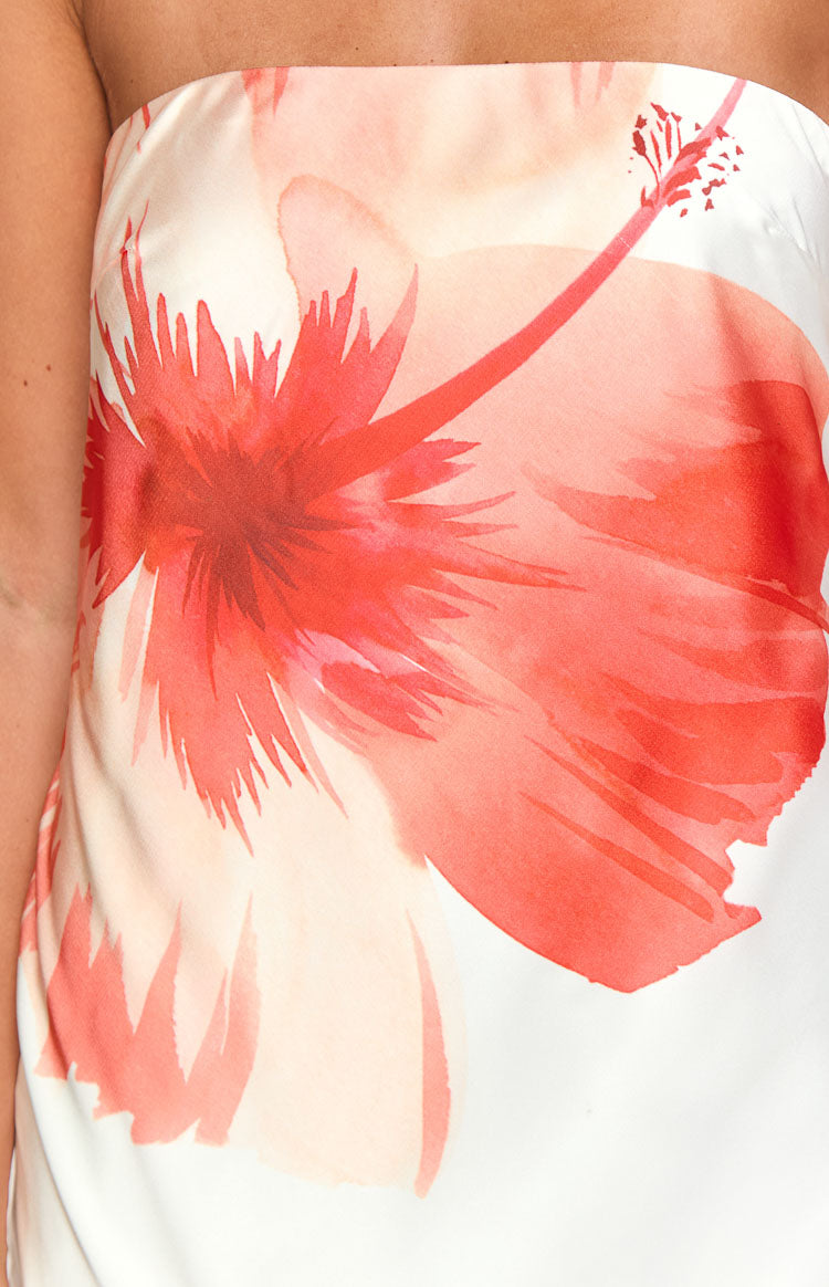 Close-up of the red watercolor hibiscus floral print on the white maxi dress fabric