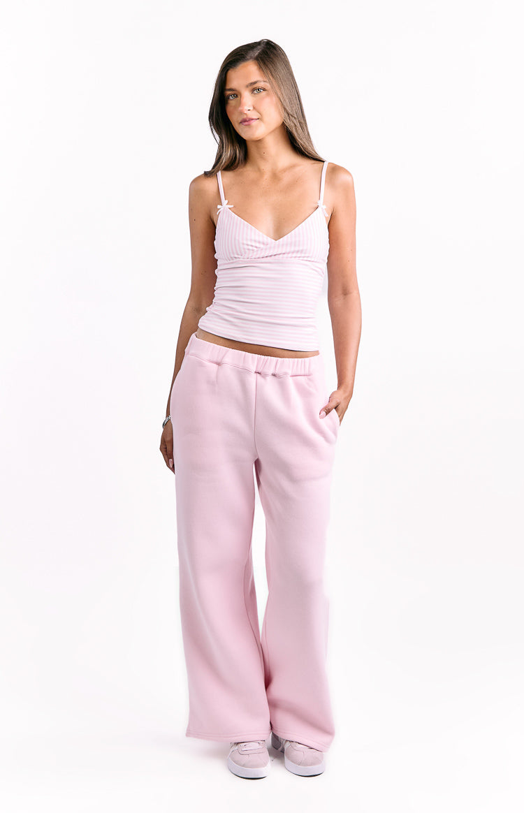 Full length light pink wide-leg track pants with an elasticated waistband and side pockets