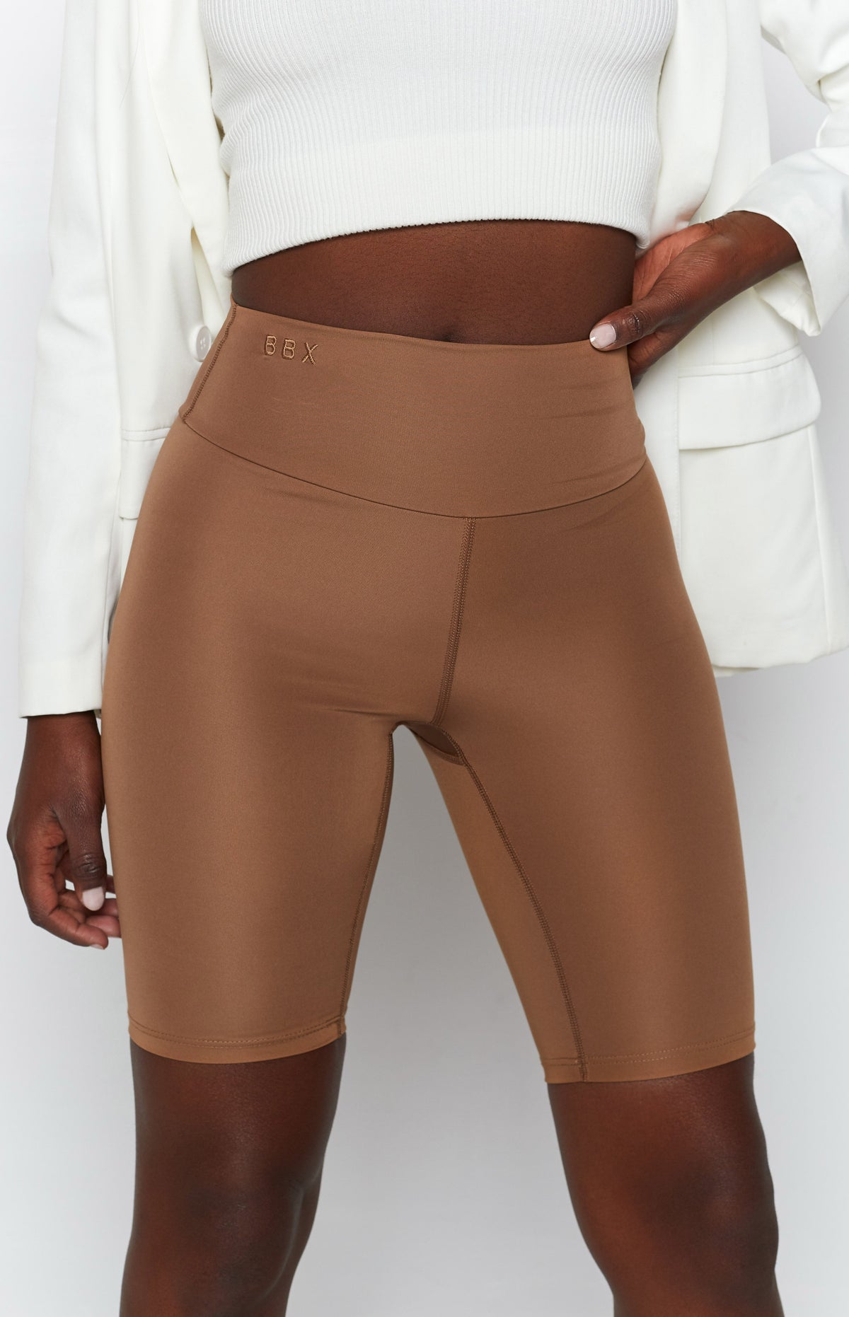 Toffee high-waisted bike shorts with BBX logo embroidery on the waistband and visible flatlock seams