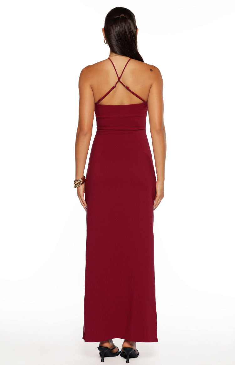 Rear view of a burgundy crepe maxi dress showing the criss-cross spaghetti straps and low back