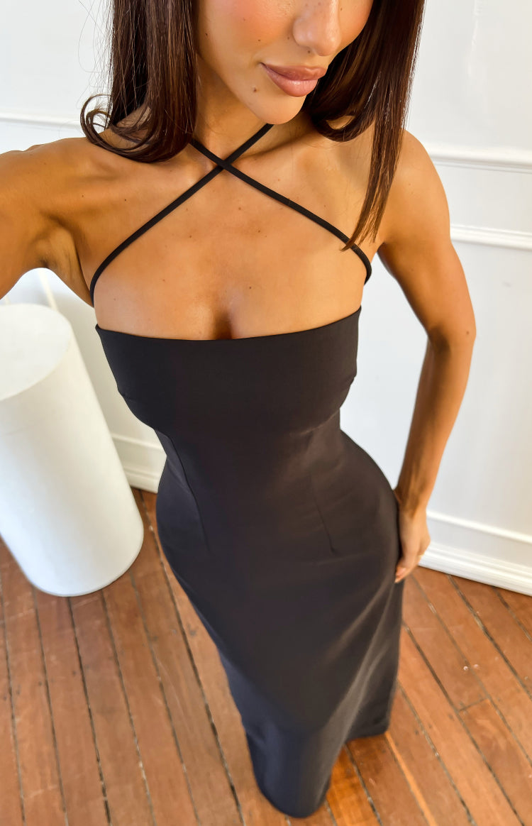 Detail of the black crepe maxi dress showing the strapless bodice and criss-cross halter straps