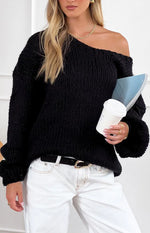 Black chunky knit sweater with an off-the-shoulder neckline and voluminous long sleeves