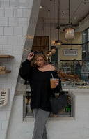 Beginning Boutique Delvey Black Chunky Knit Sweater black chunky knit oversized sweater with a V-neck and long sleeves