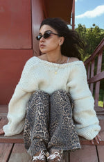 Brunet leopard print straight leg jeans with dark brown and grey spots, gathered at the knees