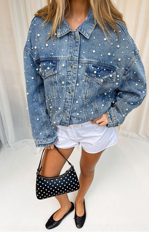 Beginning Boutique Denim Dazzle Pearl Mid Wash Denim Jacket mid wash denim jacket with pearl studs, classic collar, button fr