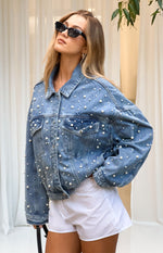 Relaxed fit mid wash denim jacket with scattered pearl embellishments and button-flap chest pockets