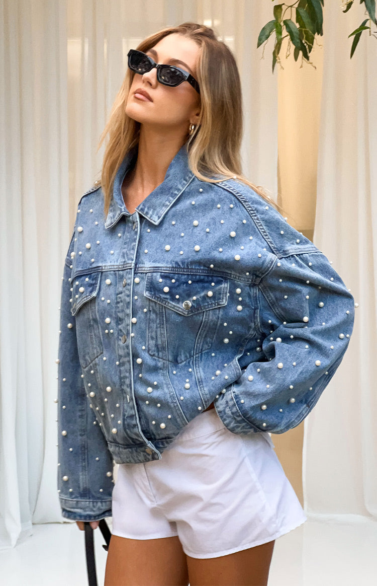 Relaxed fit mid wash denim jacket with scattered pearl embellishments and button-flap chest pockets