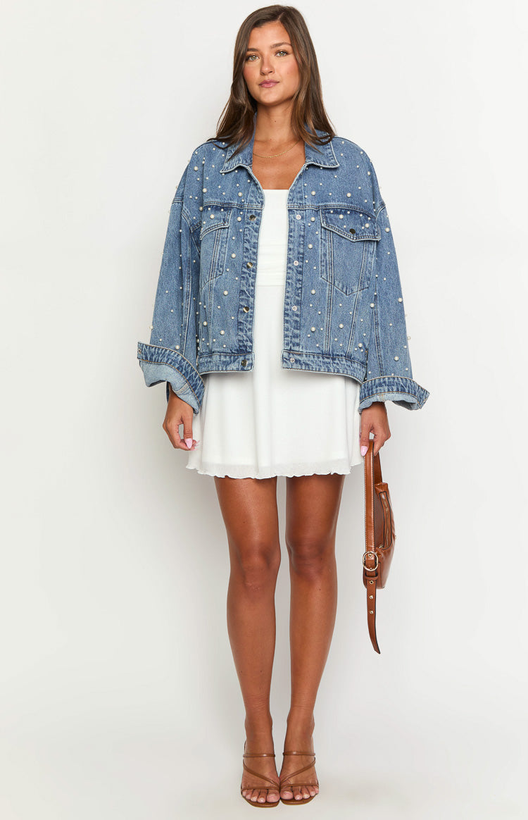 Oversized mid wash denim jacket with all-over pearl embellishments and rolled cuffs