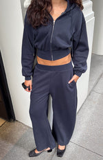 Beginning Boutique Dora Navy Barrel Leg Track Pants navy barrel leg track pants with an elasticated waistband and side pockets