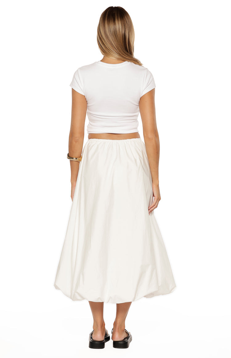 Rear view of the white bubble hem skirt with an elasticated waist and voluminous silhouette