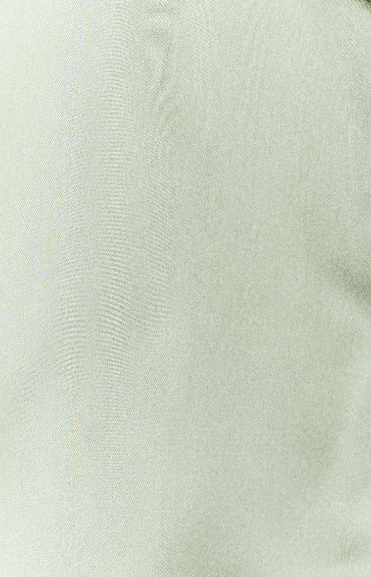 Close-up of the olive satin fabric showing its subtle sheen and weave texture