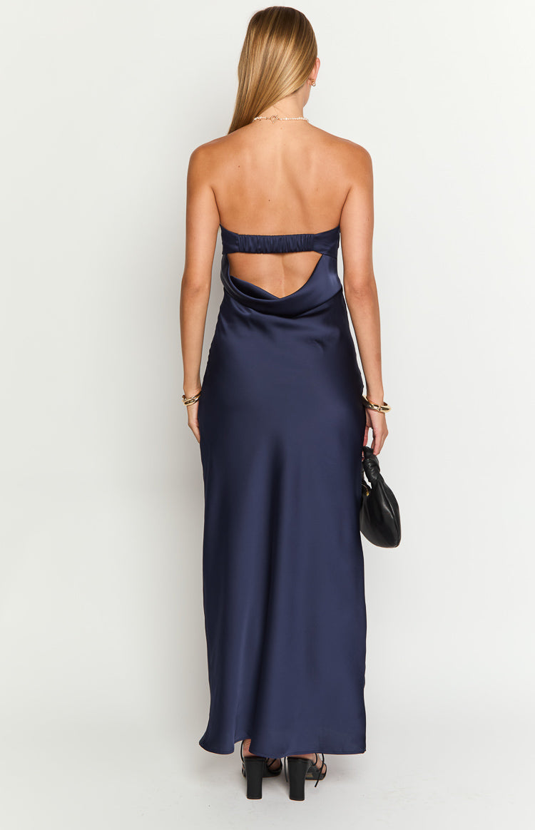 Rear view of a navy strapless maxi dress with an elasticated back band and cowl drape