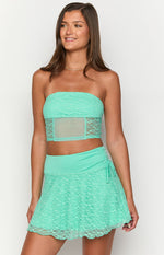 Teal strapless lace corset top with a sheer mesh midriff panel and cropped hem