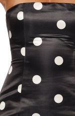 Close-up of the black satin strapless bodice with white polka dots, showing the side seam and fabric texture
