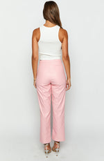 Rear view of pink PU leather pants with V-shaped back waist seam and vertical leg seams