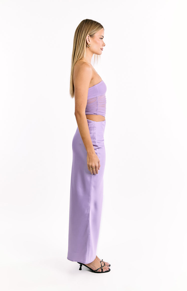 Side view of a lilac satin maxi dress with a strapless ruched mesh bodice and a smooth, floor-length skirt