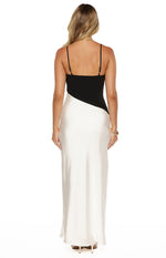 Rear view of a black and white satin maxi dress with thin adjustable spaghetti straps and a straight back neckline