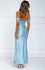 Rear view of a light blue satin off-shoulder maxi dress with a low scoop back and flowing skirt