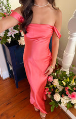 Angled view of a pink satin off-shoulder formal dress, highlighting the elegant drape of the fabric across the bodice and arms