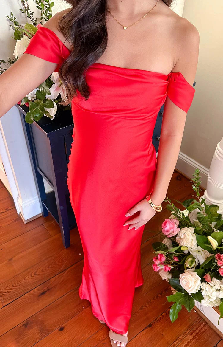 Close-up of the red off-shoulder formal dress showing the folded neckline and smooth satin fabric